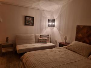 a living room with two beds and a couch at feelings in Punta Arenas