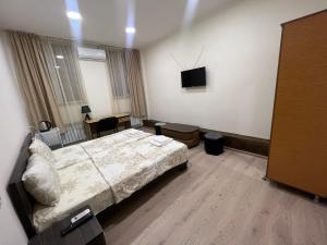 Voodi või voodid majutusasutuse Arm Hotel toas