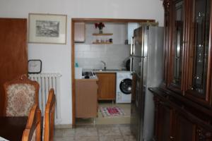 a kitchen with a stainless steel refrigerator in a room at BELLA VISTA BOLOGNESE in Trespiano