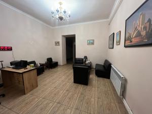 an office with a desk and chairs in a room at Arm Hotel in Yerevan