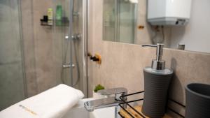 a bathroom with a sink and a shower at Baltic Sea Flair: Just steps from the sea in Dziwnów