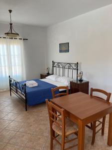 Postel nebo postele na pokoji v ubytování ΞΕΝΟΔΟΧΕΙΟ ΑΚΡΩΤΗΡΙ
