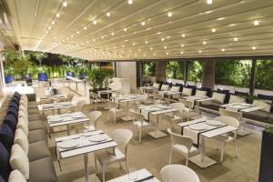 an image of a restaurant with tables and chairs at Kalyon Cesme in Çeşme