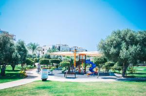 a playground in a park with a slide at Premium Sun Apartment in Vokolidha