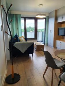 Ένα ή περισσότερα κρεβάτια σε δωμάτιο στο Apartament Augustów ,Arnikowa