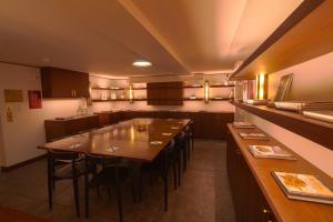 a dining room with a long table and chairs at The Evelyn NoMad in New York