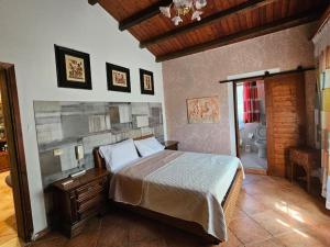 a bedroom with a bed and a bathroom at Gulliver's Nest in Castellammare del Golfo