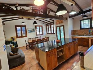 a kitchen with a large island in a room at Gulliver's Nest in Castellammare del Golfo