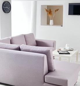 a living room with a couch and a table at Dear John in Hydra +21 photos