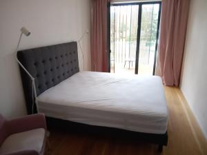 Molo Lipno Rezidence tesisinde bir odada yatak veya yataklar