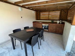 Kuchyň nebo kuchyňský kout v ubytování Chambre Paradise