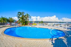 a swimming pool with a view of the ocean at Old Wooden Bridge Resort & Marina in Big Pine Key