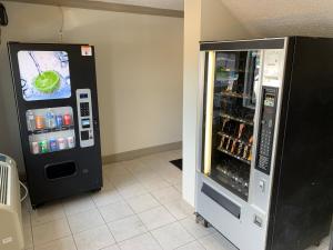 a black refrigerator with a video game on its door at Red Roof Inn & Suites Vineland - Buena in Buena