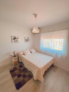 a bedroom with a bed and a window at Mi Sueño by Residea in Torremolinos +14 photos