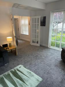 a living room with a couch and a table at Washington Village Apartment in Washington