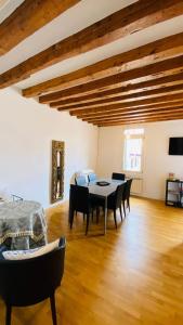 a dining room with a table and chairs at San Maurizio Apartment in Venice