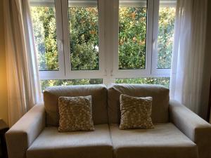 Posedenie v ubytovaní APARTAMENTO MOZART con GARAJE CERCA GRATUITO Portonovo Centro