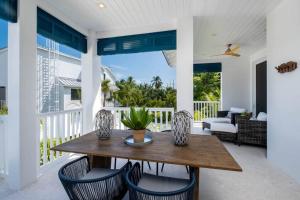 a dining room with a table and chairs at Islamorada Modern Penthouse with Private Beach in Islamorada