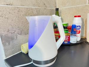 a white blender sitting on top of a counter at Apartment Volcano Beach in Alcalá