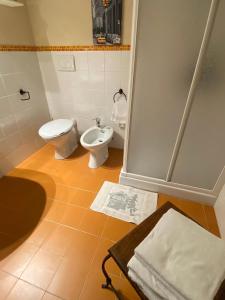 a bathroom with a toilet and a bidet at Maison Maribel 0043 in Pré-Saint-Didier