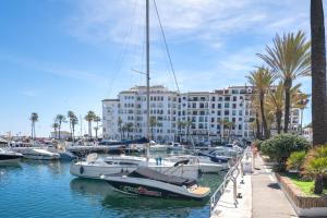 a group of boats are docked in a marina at 11 Modern apt with sea views, two poolareas, close to parks & beaches Manilva in Manilva