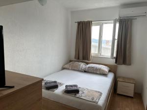 Postel nebo postele na pokoji v ubytování Royal Apartments