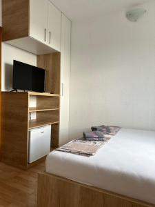 Postel nebo postele na pokoji v ubytování Royal Apartments
