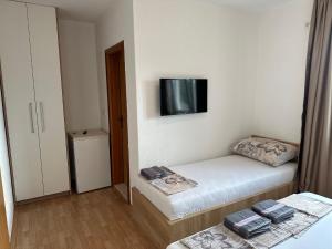 Postel nebo postele na pokoji v ubytování Royal Apartments