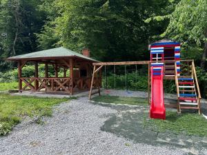 a playground with a fire hydrant and a gazebo at The Loft in Sovata
