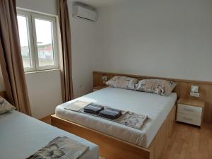 Postel nebo postele na pokoji v ubytování Royal Apartments