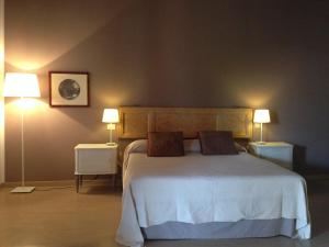 Tempat tidur dalam kamar di Agriturismo Cascina Magana