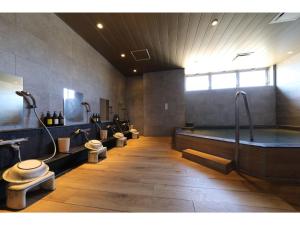 a bathroom with four toilets and a bath tub at Hotel Torifito Kashiwanoha - Vacation STAY 75950v in Kashiwa +59 photos