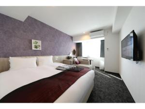 מיטה או מיטות בחדר ב-Hotel Torifito Kashiwanoha - Vacation STAY 75949v