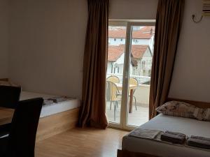 Postel nebo postele na pokoji v ubytování Royal Apartments