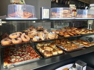 a bakery filled with lots of different types of pastries at B&B Casa Benvenuto in Diamante