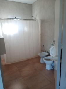 a bathroom with a toilet and a bidet at Finca Casiana in Villa Krause