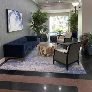 a lobby with couches and a table in a room at Wyndham Houston near NRG Park - Medical Center in Houston