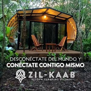 una casa en el árbol en medio del bosque en Zil-Kaab Hidden Glamping Village, en Tulum