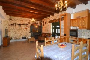a kitchen and living room with a table and a dining room at Erietas House in Chania Town