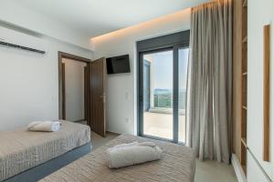 Posteľ alebo postele v izbe v ubytovaní Villas 107 - Homeleader