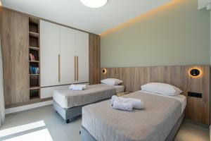Posteľ alebo postele v izbe v ubytovaní Villas 107 - Homeleader