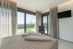 Posteľ alebo postele v izbe v ubytovaní Villas 107 - Homeleader