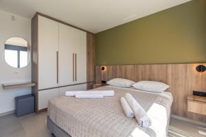 Posteľ alebo postele v izbe v ubytovaní Villas 107 - Homeleader