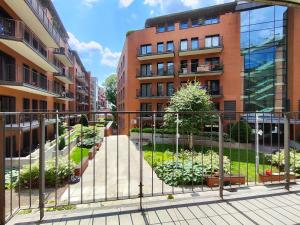 a walkway in front of an apartment building at Turnau City Aparthotel in Kraków