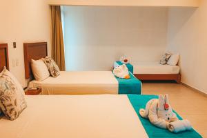 Postel nebo postele na pokoji v ubytování Hotel Boutique Naj Casa Holbox