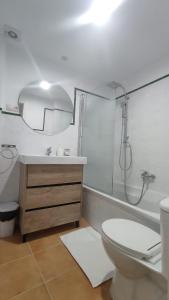 a bathroom with a shower and a toilet and a sink at Villa Xunqueira 2 in Cee