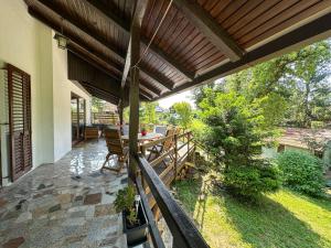 a porch of a house with a wooden deck at Kuća za odmor PIKA - Mrežnica in Duga Resa