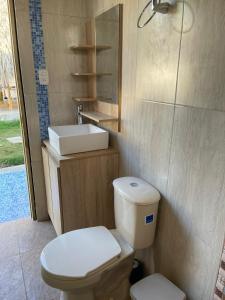 a bathroom with a toilet and a sink at Casa Finca La 58 Melina Real 
