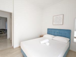 A bed or beds in a room at Acropolis View Dream Apartments