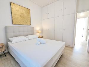 A bed or beds in a room at Acropolis View Dream Apartments